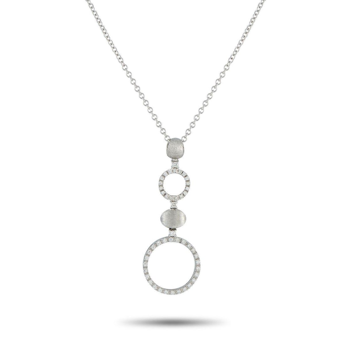 NANIS 18K WHITE GOLD 0.65CT DIAMOND NECKLACE: A sleek, contemporary design makes this Nanis necklace an elegant addition to any jewelry collection. Set in 18K White Gold, the circular forms are elevated by sparkling Diamonds with a total weight o
