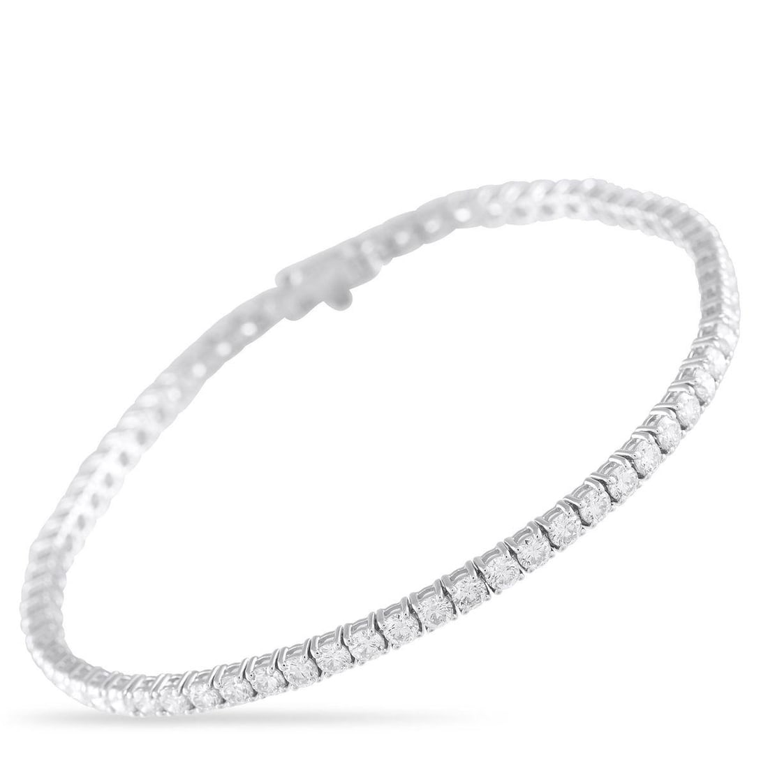 14K WHITE GOLD 4.65CT DIAMOND TENNIS BRACELET: No outfit is complete without a subtle touch of sparkle. On this timeless tennis bracelet, the simple 14K White Gold setting comes to life thanks to a series of round-cut Diamonds totaling 4.65 carats