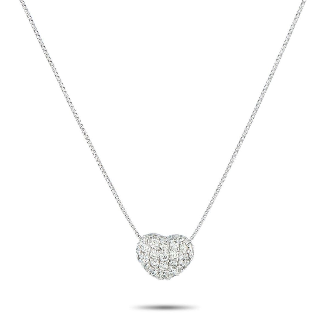 18K WHITE GOLD 1.0CT DIAMOND PAVE HEART NECKLACE: An piece that captures a lifetime of light and love. It features a box chain holding a heart pendant blanketed in 1.0 carat of brilliant pav diamonds. The petite stones create a seamless sheet of spar
