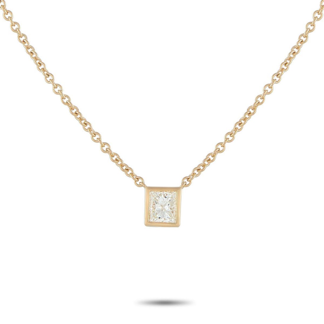 18K YELLOW GOLD 0.60CT PRINCESS-CUT DIAMOND SOLITAIRE NECKLACE: A simple and refined piece perfect for daily wear. A sharp, square princess-cut diamond takes center stage, its facets catching light with crisp, geometric brilliance. It is held securely by a smooth