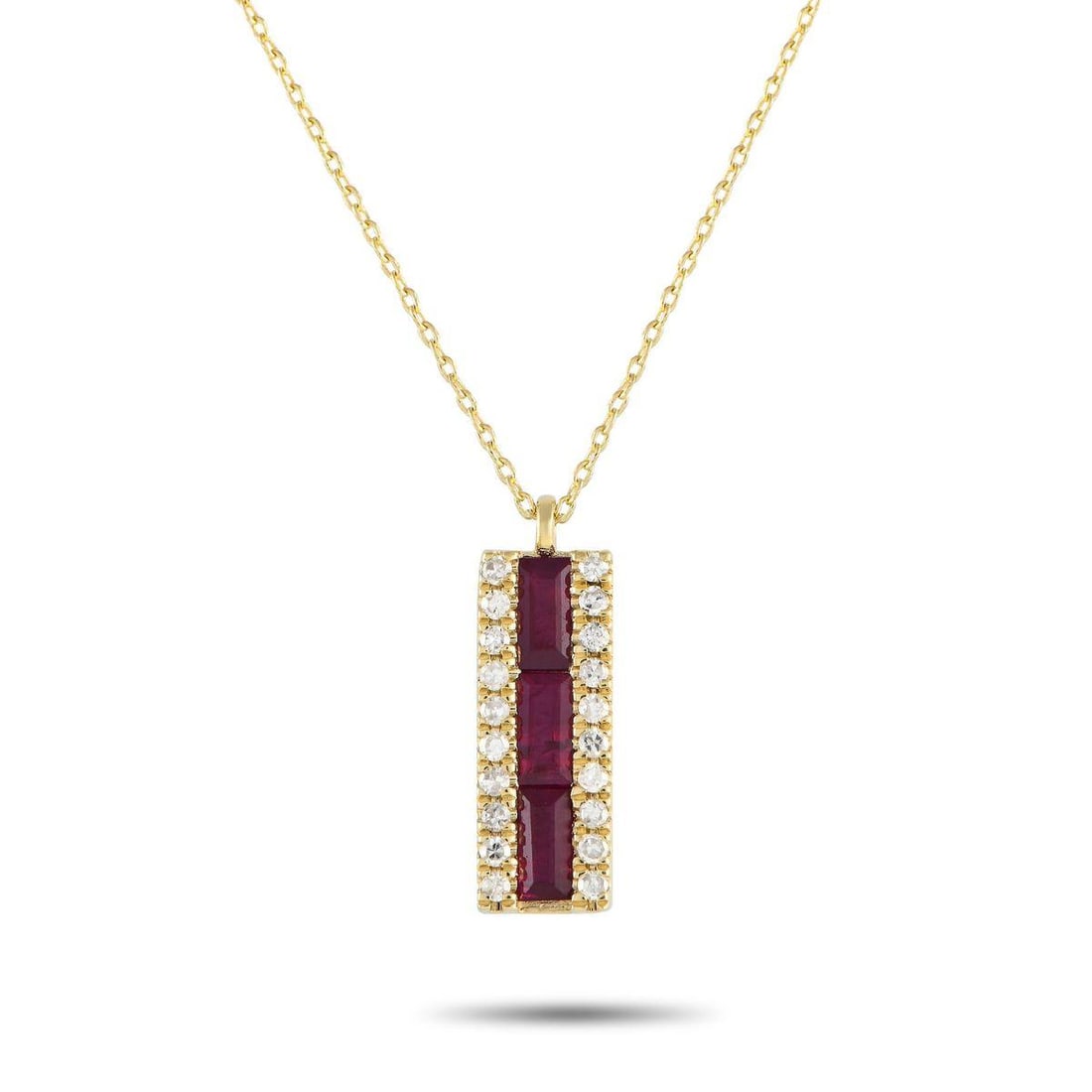 14K YELLOW GOLD 0.10CT DIAMOND AND RUBY PENDANT NECKLACE: A row of Ruby gemstones is accented by round-cut Diamonds totaling 0.10 carats on this exquisite necklace. Crafted from 14K Yellow Gold, the pendant measures 0.65 long by 0.20 wide and is suspended fr