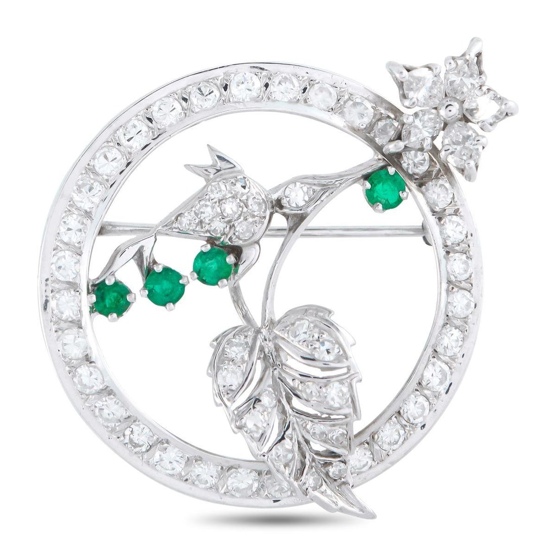 18K WHITE GOLD 2.20CT DIAMOND BROOCH: This luxury brooch draws inspiration from nature. Flower and leaf motifs elevate the circular, openwork design. Diamonds totaling 2.20 carats provide endless sparkle, while green gemstones add a strik