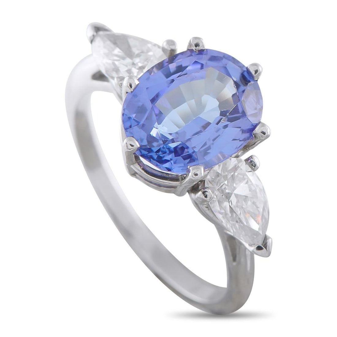 18K WHITE GOLD 0.90 CT DIAMOND AND 3.0 CT TANZANITE RING: Light in hand yet assured in detail, this ring is for the jewelry lover who demands maximum impact from the most minimalist foundation. The 1mm shank rises to a towering 7mm height, suspending a 3.0-c