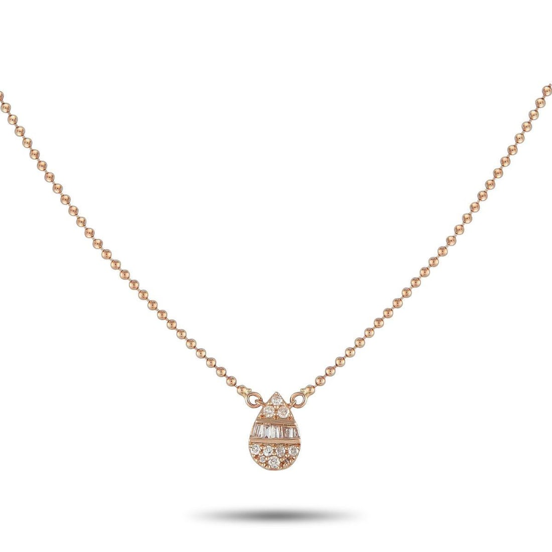 14K ROSE GOLD 0.11CT DIAMOND NECKLACE: You'll find yourself reaching for this necklace daily. Crafted for comfort and versatility, it features a fine and lightweight ball chain holding a pear-shaped cluster pendant of round and baguette di