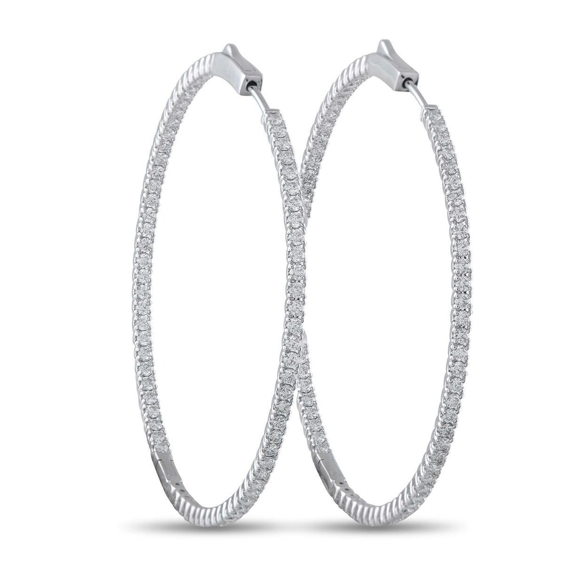 14K WHITE GOLD 2.40CT DIAMOND INSIDE-OUT HOOP EARRINGS: Diamonds with a total weight of 2.40 carats allow these luxury hoop earrings to seemingly radiate light. Stylish and sophisticated, the minimalist 14K White Gold setting measures 1.88 round.This jewel
