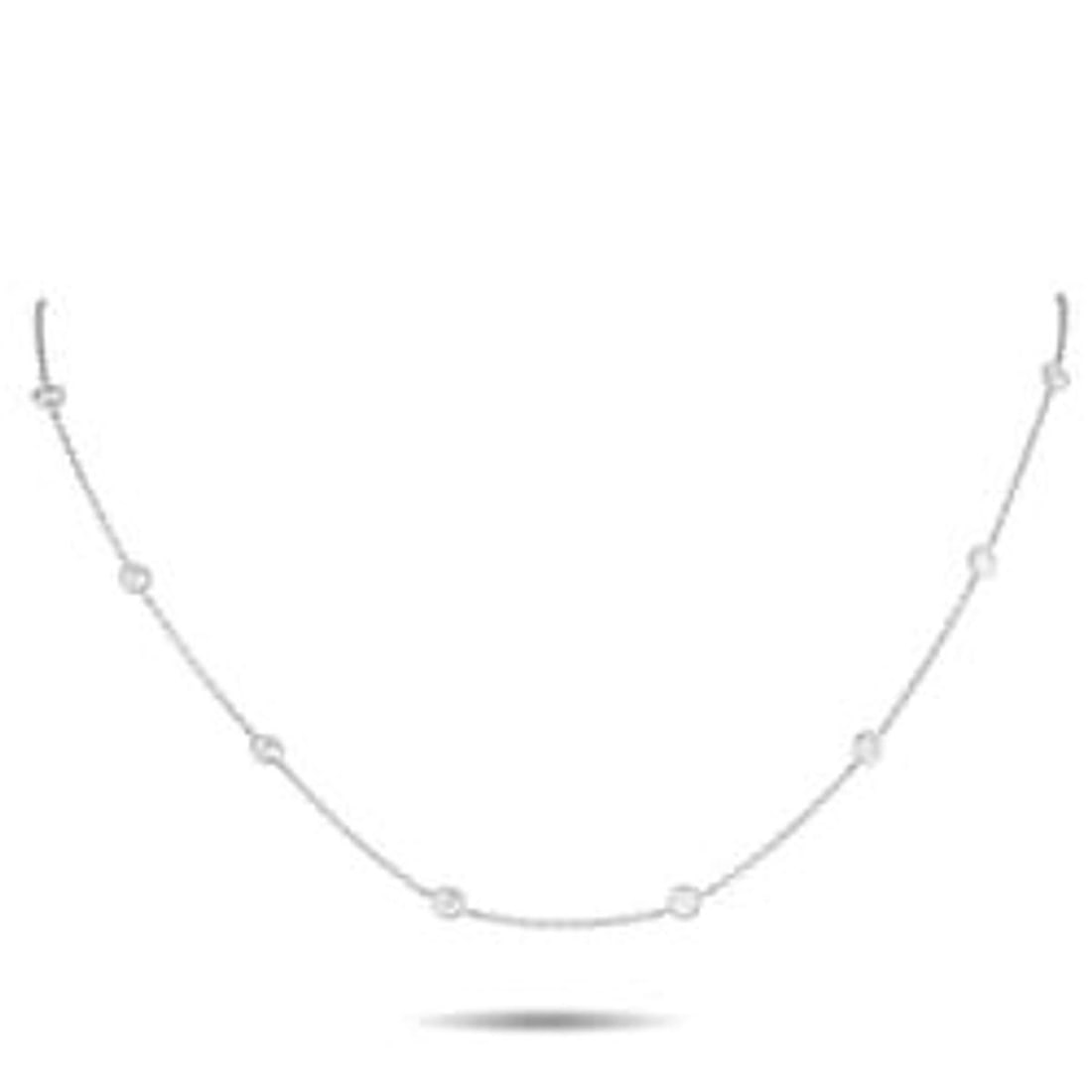 18K WHITE GOLD 1.50CT DIAMOND STATION NECKLACE: This necklace will effortlessly elevate any ensemble. The delicate chain comes to life thanks to sparkling bezel set Diamonds totaling 1.50 carats. Its crafted from 18K White Gold and measures 18 long