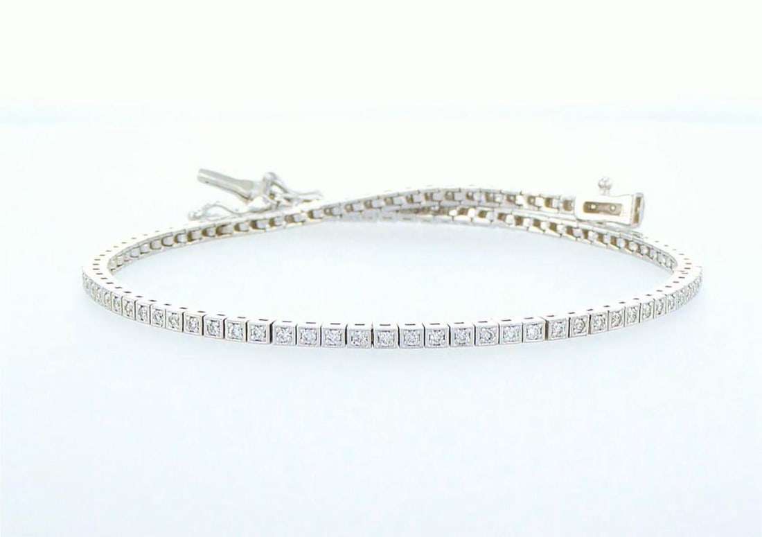 14kt White Gold 0.5ctw Diamond Tennis Bracelet: One 5.28 gr. 14kt White Gold Diamond Tennis Bracelet Jewelry Weight: 5.28Grs Total Diamonds Weight: 0.5Cts Main Stones Description: Quantity: 100 Cut and shape: Round Brilliant Carats Weight: 0.5 Clar