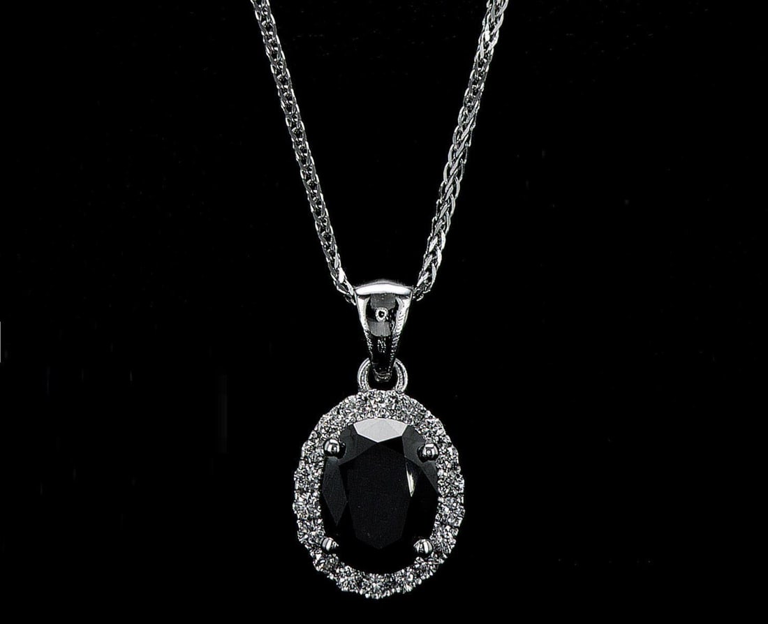 14kt White Gold 2.28ctw Diamond Pendant: One 14k white gold pendant with chain (14k stamped), set with one center black diamond and small natural diamonds around. Jewelry Weight: 3.06Grs Total Diamonds Weight: 2.28Cts Main Stones Description