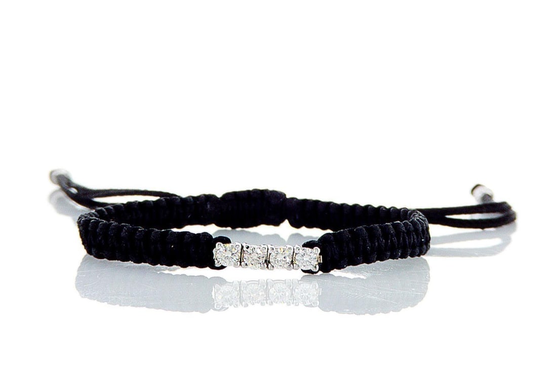 14kt White Gold 0.2ctw Diamond Bracelet: Jewelry Description Description: One 14k white gold bracelet, set with natural diamonds. Jewelry Weight: 1.71 Grs Total Diamonds Weight: 0.2 Cts Precious Metal: 14kt White Gold Certificate Number: DSL