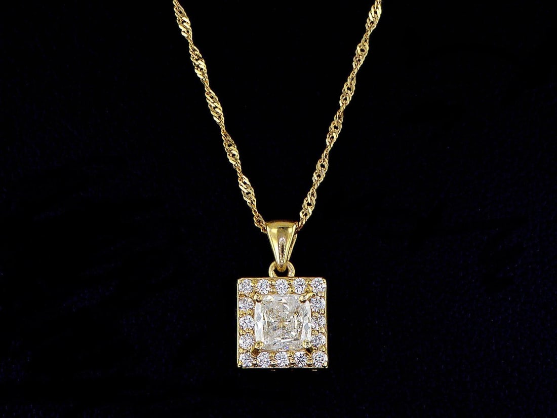 14kt Yellow Gold 0.68ctw Diamond Pendant: One 14k yellow gold pendant with chain (14k stamped), set with one center natural diamond and small natural diamonds around. Natural diamonds description: Cut and shape: Cushion & Round. Total Weight: