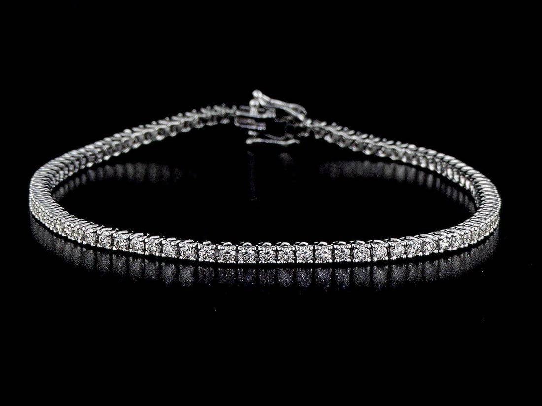14kt White Gold 1.61ctw Diamond Tennis Bracelet: One 14k white gold bracelet "tennis" (14k stamped) set with natural Diamonds. Natural diamonds description: Cut and shape: Round Brilliant. Total Weight: 1.61 cts. Cut/polish/symmetry: Excellent/Excel