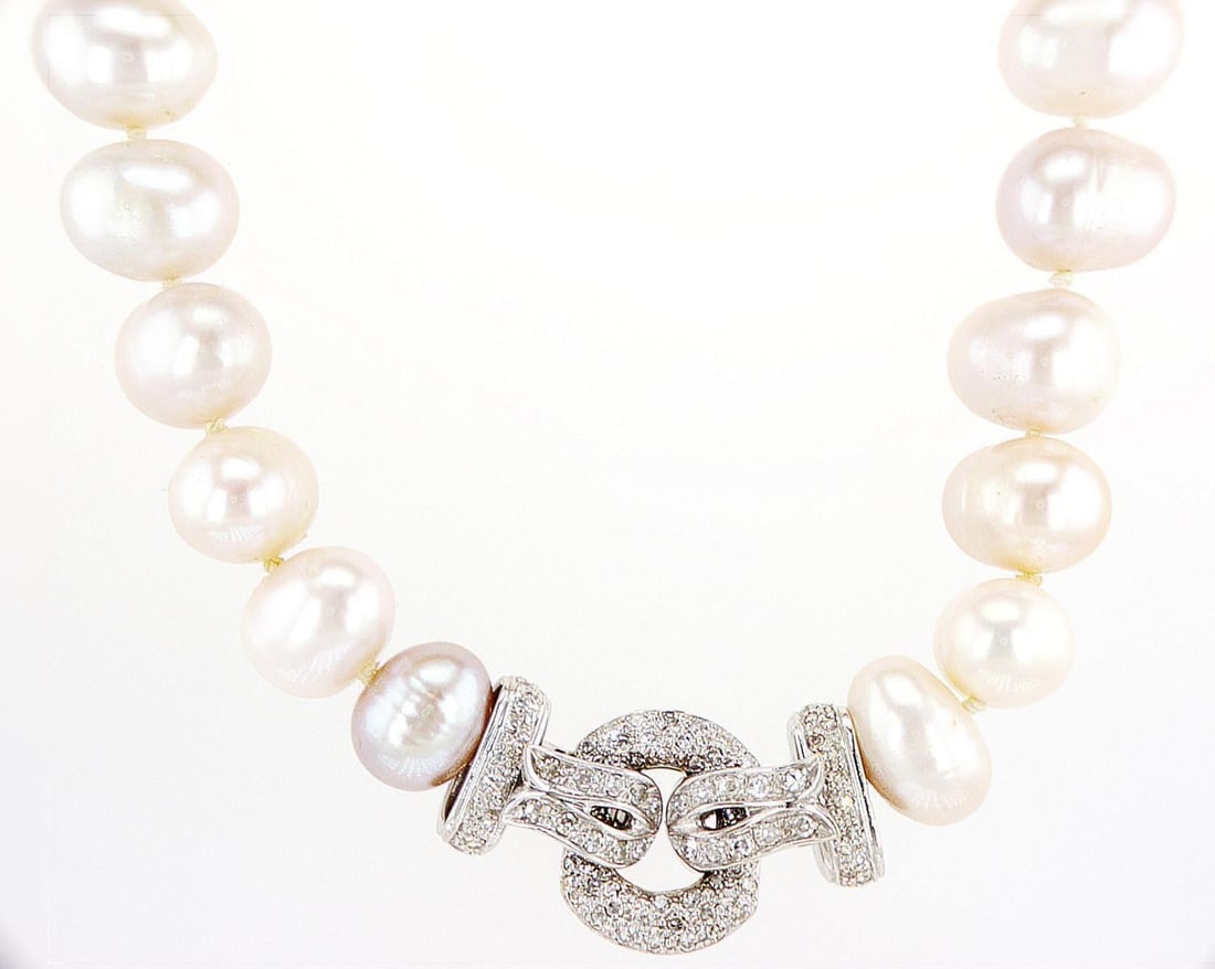 18kt White Gold 1ctw Diamond Necklace: One 18k white gold pendant, set with natural diamond and pearls. Jewelry Weight: 83.67Grs Total Diamonds Weight: 1Cts Main Stones Description: Quantity: 40 Cut and shape: Pearl Color: Cream Side Stone