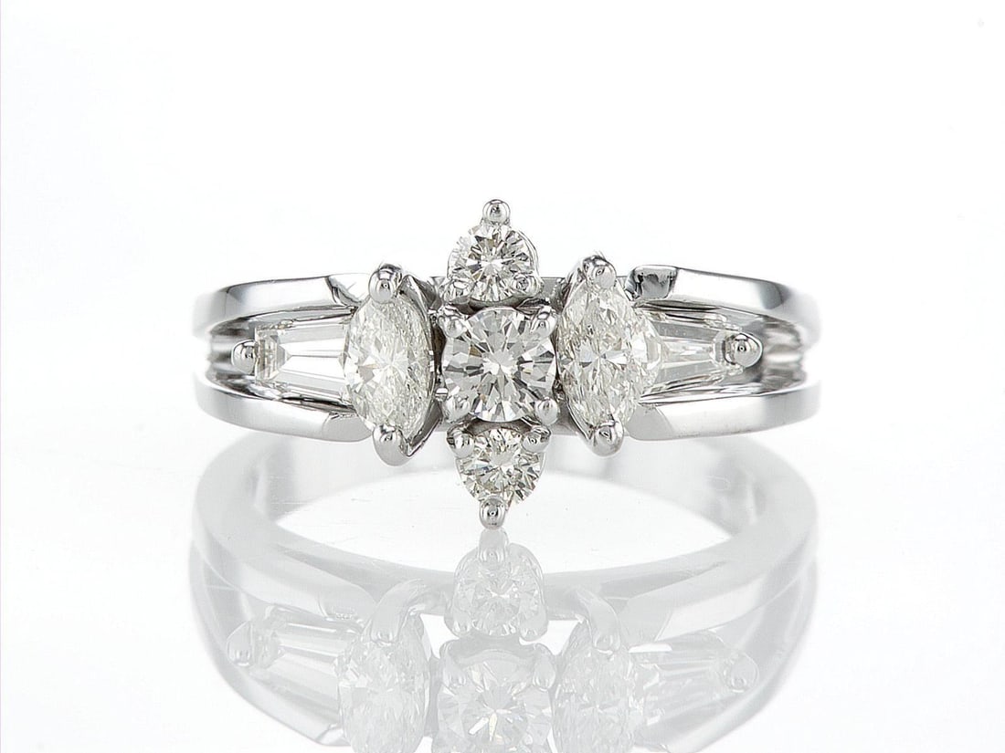 18kt White Gold 0.8ctw Diamond Ring: One 18k white gold ring (18k stamped), set with natural diamonds. Jewelry Weight: 5.86Grs Total Diamonds Weight: 0.8Cts Main Stones Description: Quantity: 3 Cut and shape: Round Brilliant Carats Weigh