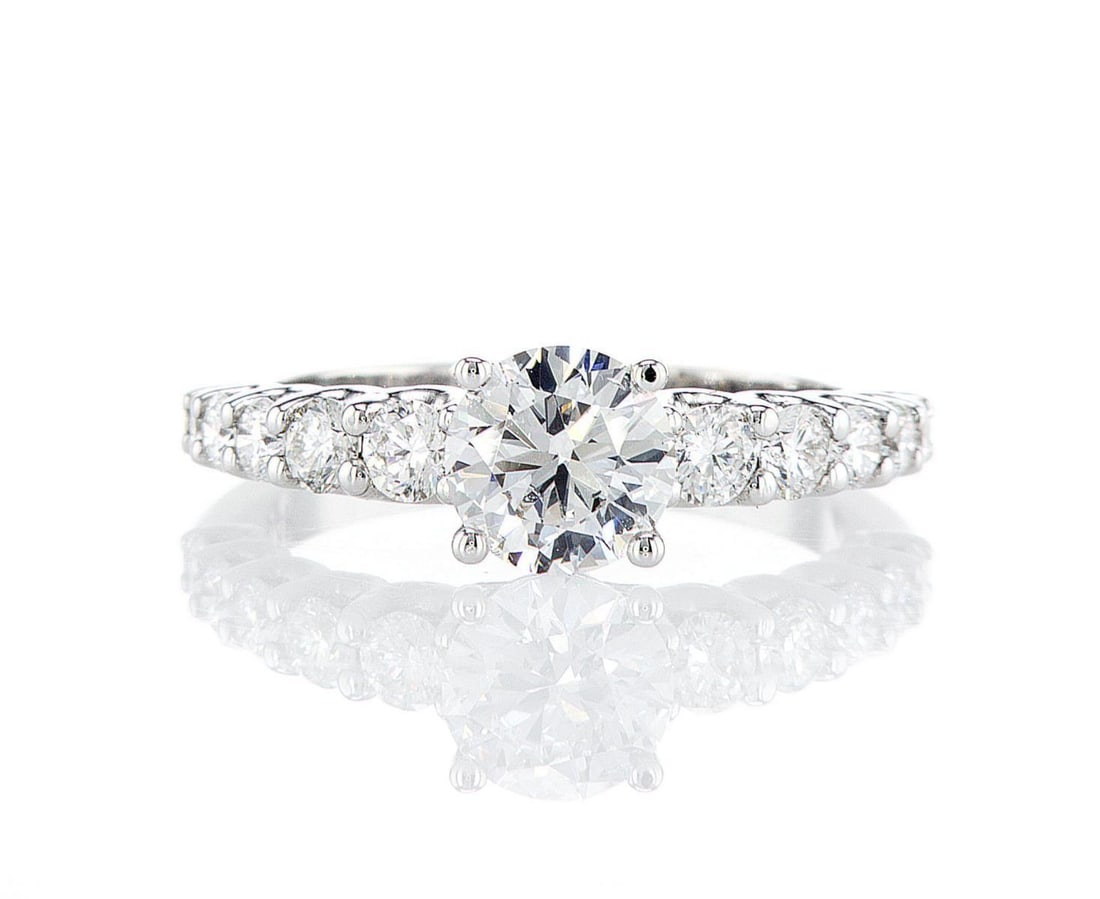 14kt White Gold 1.3ctw Diamond Ring: One 14k white gold ring (14k stamped), set with one center lab grown diamond and small lab grown diamonds on the sides. Jewelry Weight: 3.34Grs Total Diamonds Weight: 1.3Cts Main Stones Description: Q