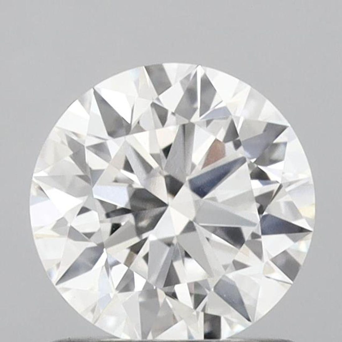 Lab Grown 1.05 ct, Color E/VS1 IGI Graded Diamond: Lab/Natural Diamond: Lab Carat Weight: 1.05 Color Grade: E Clarity Grade: VS1 Model: Round Fluorescence: None Polish: Excellent Symmetry: Excellent Depth: 60.6 Table: 56 Cut Grade: Ideal Size: 6.54-6.