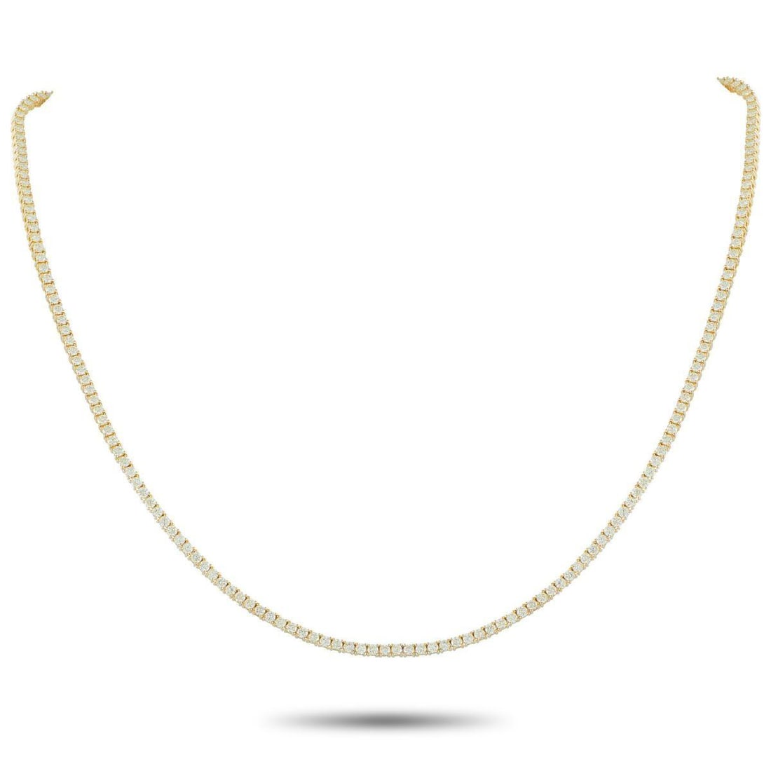 18K YELLOW GOLD 5.94CT DIAMOND TENNIS NECKLACE: This classically elegant tennis necklace is designed to effortlessly catch the light. Set in 18K Yellow Gold, sparkling Diamonds totaling 5.94 carats make it a luxury piece worthy of any event or occa