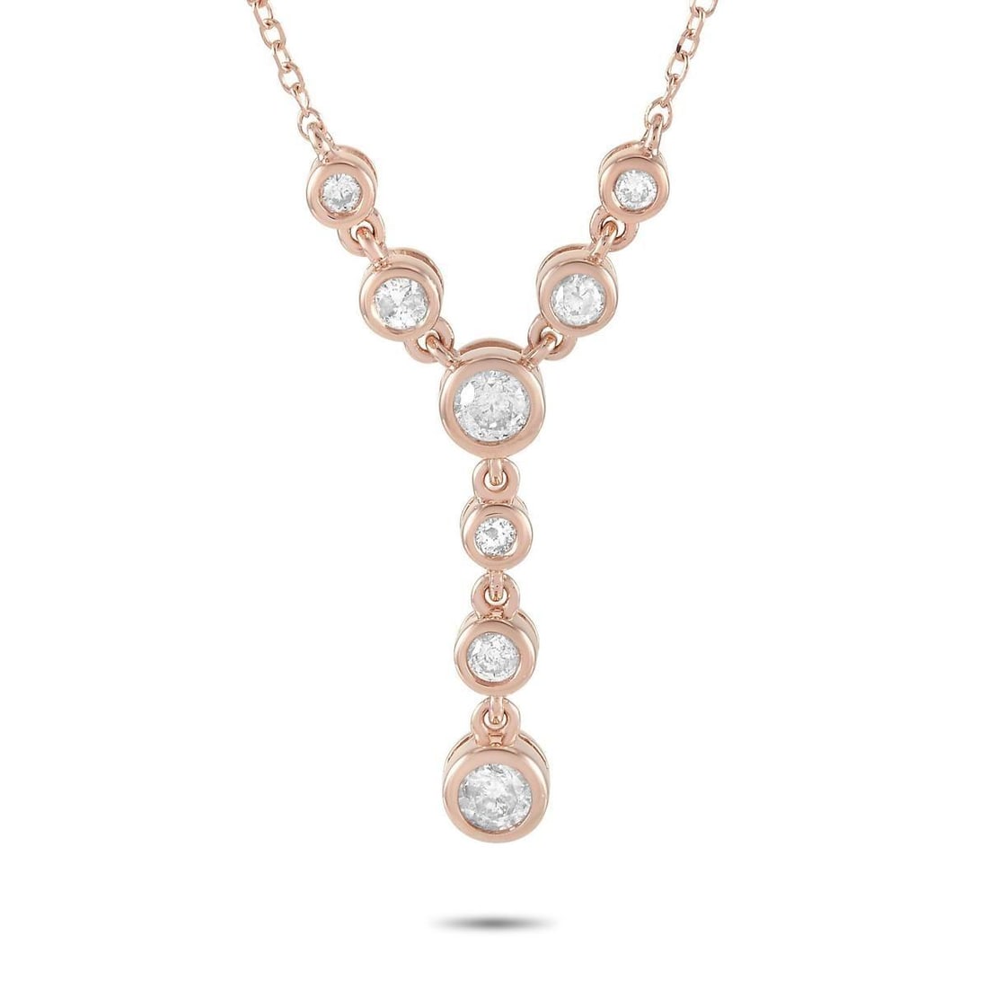 14K ROSE GOLD 0.25CT DIAMOND NECKLACE: This necklace is crafted from 14K rose gold and weighs 2.2 grams. It is presented with a 15 chain and boasts a pendant that measures 1 in length and 0.50 in width. The necklace is set with diamonds th