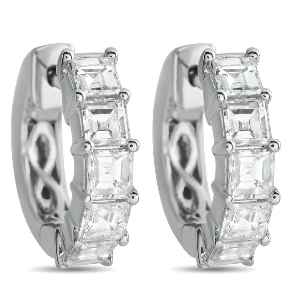 18K WHITE GOLD 1.91CT DIAMOND HUGGIE HOOP EARRINGS: In 18K white gold, these huggies carry 1.91 carats of square-cut diamonds set along the forward-facing edge in shared prongs. The diamonds are aligned tightly, forming a corridor of repeating planes t