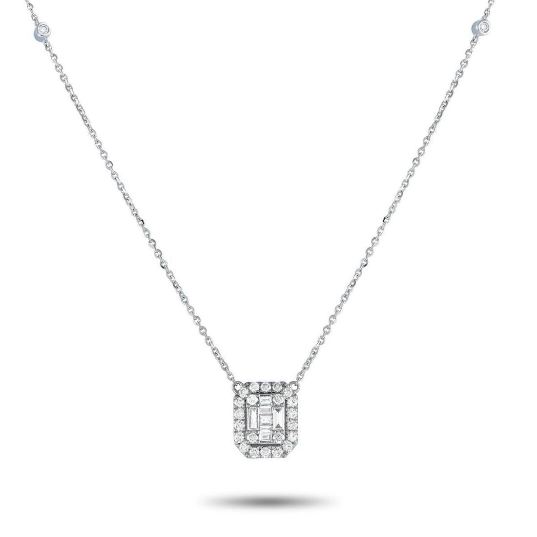 14K WHITE GOLD 0.85CT DIAMOND CUSHION HALO NECKLACE: The glittering accessory to wear when your simple outfit needs an extra dose of style. This necklace is crafted in 14K white gold, with an 18-inch-long chain fastened by a lobster clasp. The 0.5 x 0.4