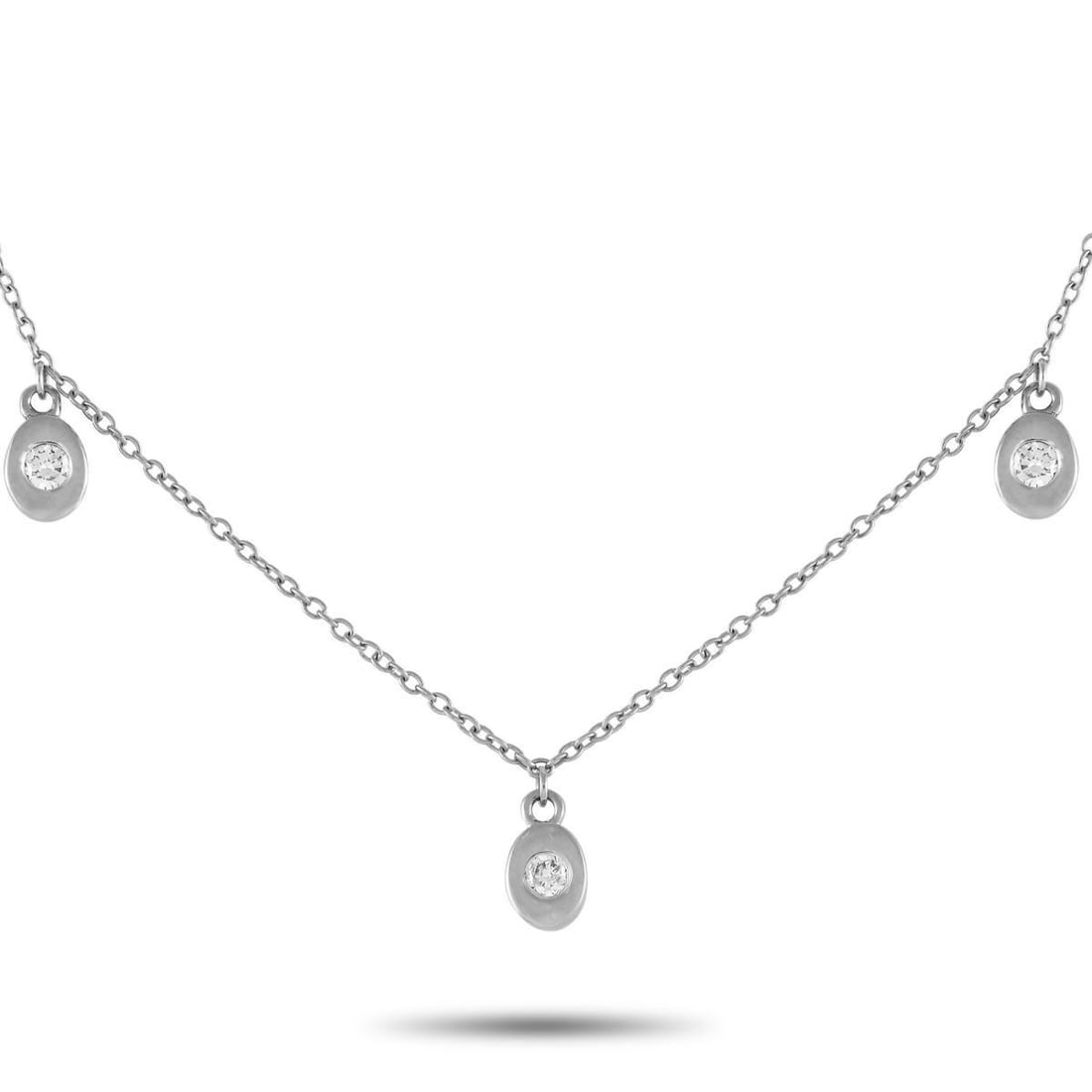 14K WHITE GOLD 0.06CT DIAMOND STATION NECKLACE: A series of 14K white gold pendants make this necklace an instant classic. On the trio of pendants, round-cut diamonds with a total weight of 0.06 carats add a touch of sparkle. Perfect for everyday w