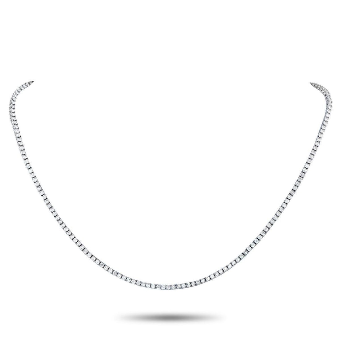 18K WHITE GOLD 5.39CT DIAMOND TENNIS NECKLACE: Undeniably elegant, this tennis necklace features 5.39 carats of finely matched round diamonds. Each stone is set on an 18K white gold prong setting, forming the full 16.75-inch length of the necklace