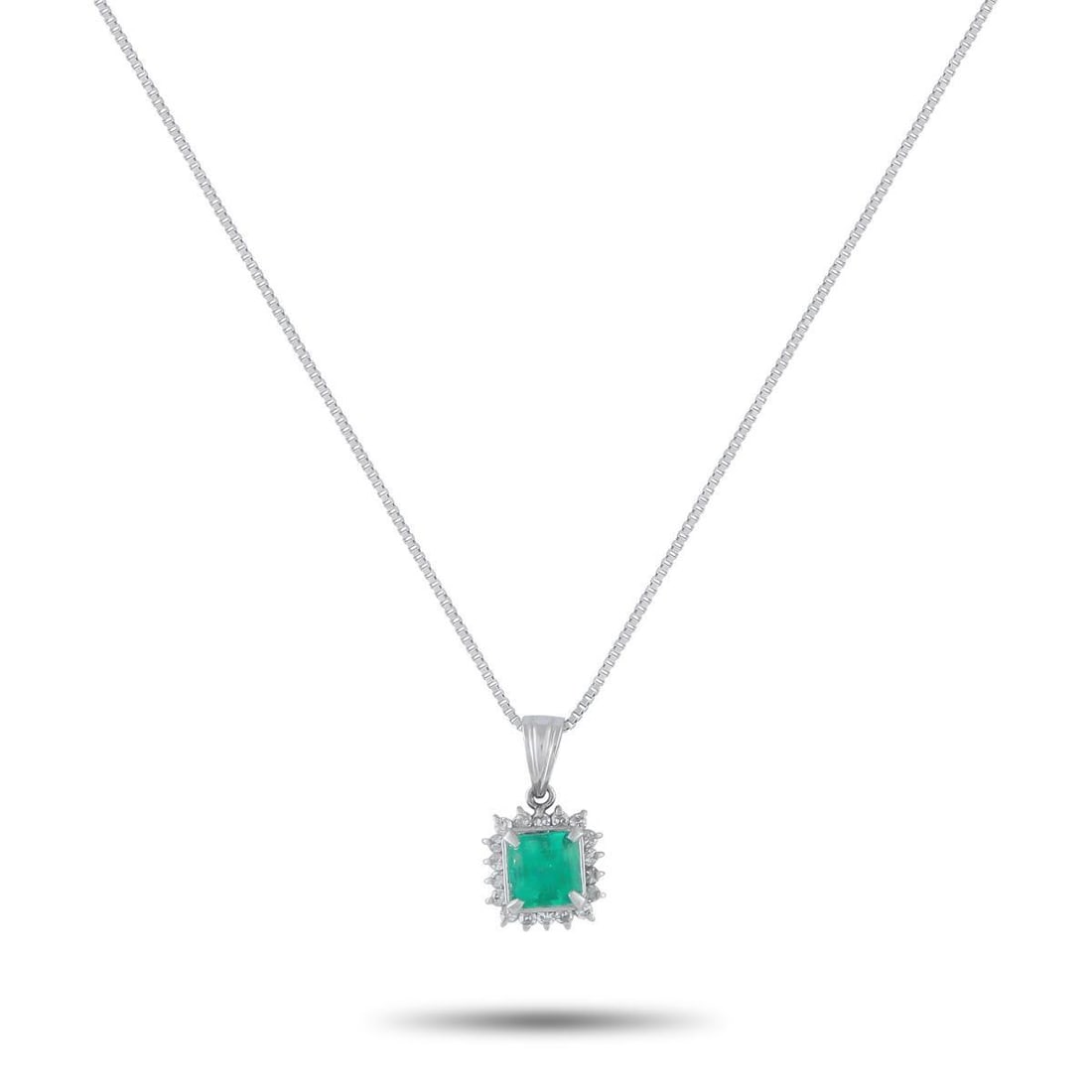 PLATINUM 0.15CT DIAMOND AND EMERALD PENDANT NECKLACE: A square-cut 0.58 carat Emerald serves as a stunning focal point on this elegant luxury necklace. Set in Platinum, Diamonds with a total weight of 0.15 carats surround the center stone and provide a s