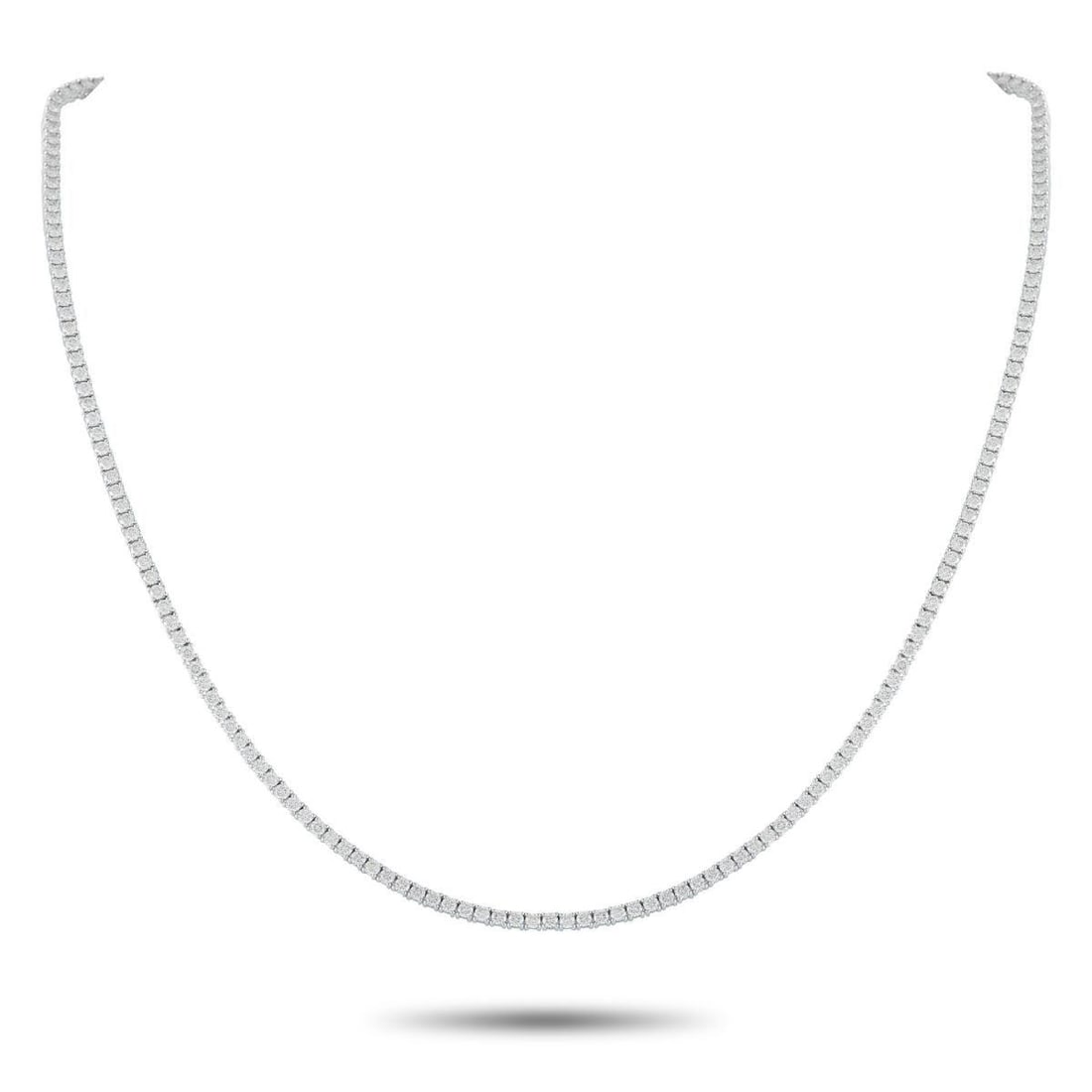 18K WHITE GOLD 5.92CT DIAMOND TENNIS NECKLACE: Add a subtle touch of luxury to any ensemble with this classic tennis necklace. The elegant, understated design shines to life thanks to a series of Diamonds totaling 5.92 carats. Set in 18K White Gol