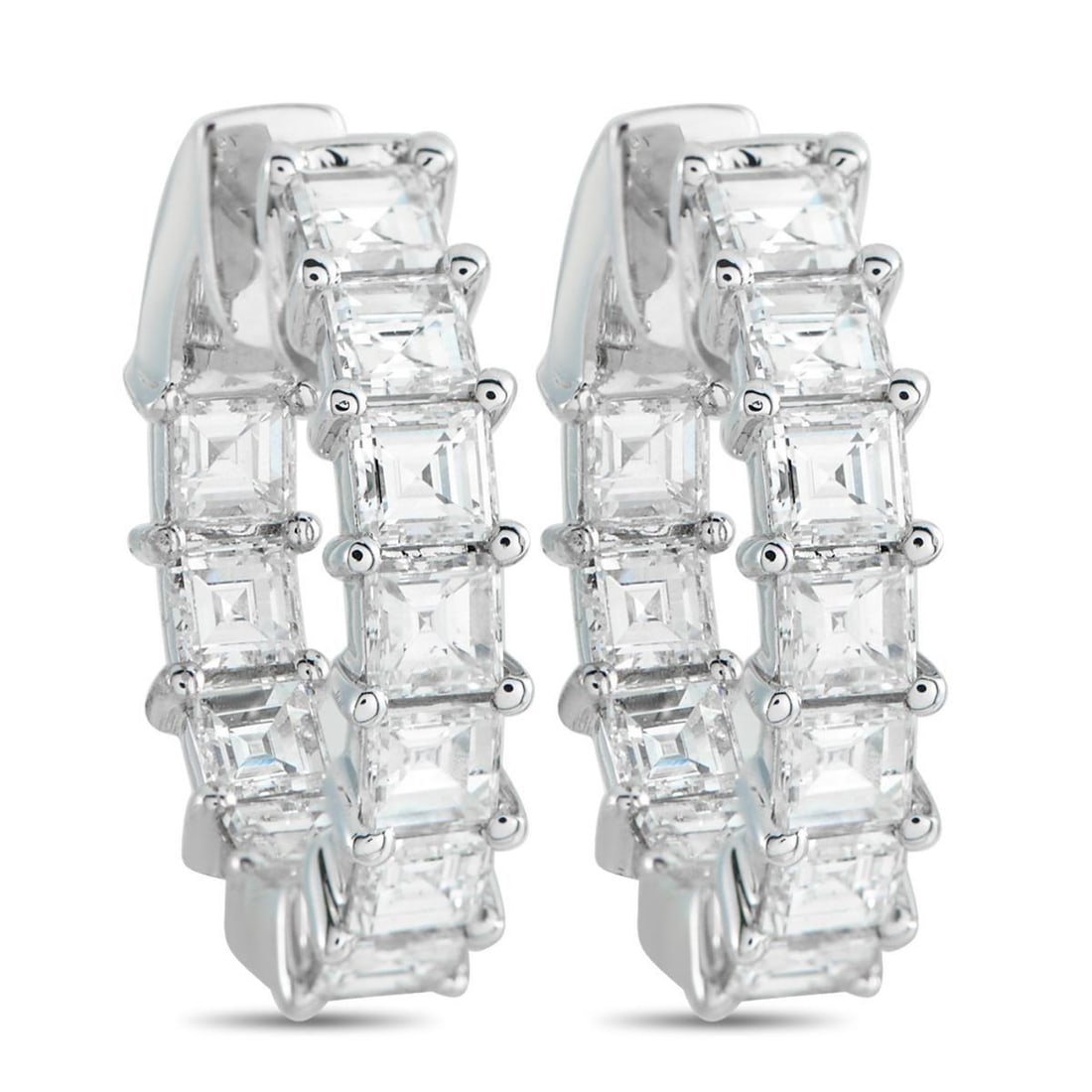 18K WHITE GOLD 3.25CT DIAMOND INSIDE-OUT HOOP EARRINGS: Set with carr-cut diamonds in shared prongs, these 0.75-inch inside-out hoop earrings look visually strong even with their compact size. Each diamond is square and sharply faceted, with the concentric