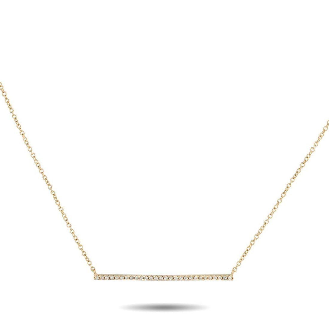 14K YELLOW GOLD 0.10CT DIAMOND PENDANT NECKLACE: An understated design makes this necklace ideal for any minimalist. The sleek pendant sparkles to life thanks to a series of Diamonds totaling 0.10 carats. Set in 14K Yellow Gold, the pendant measures