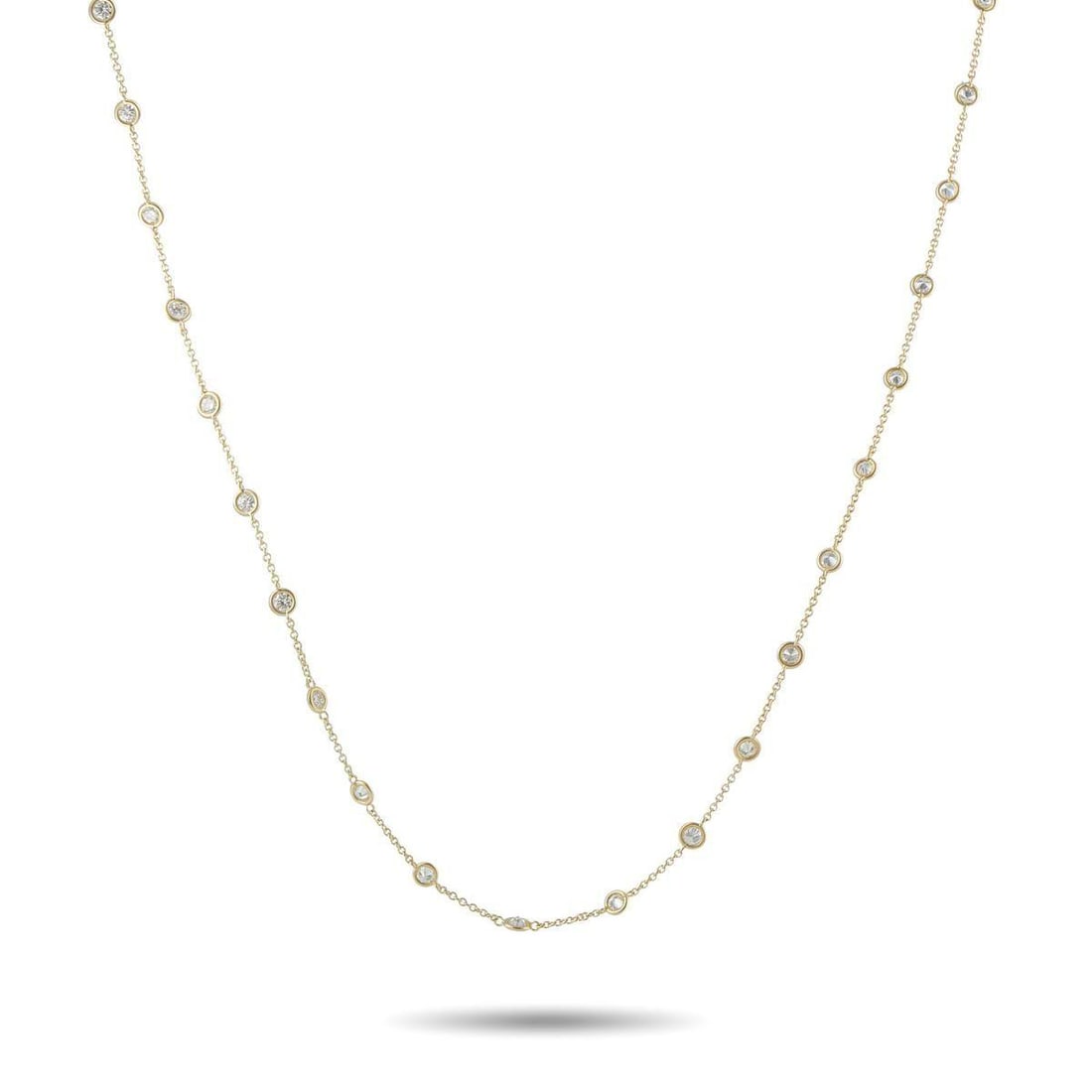 14K YELLOW GOLD 4.42CT DIAMOND STATION NECKLACE: A dramatic length and an understated sense of style provide this Diamonds By The Yard style necklace with beautiful balance. Stylish and sophisticated, the 14K Yellow Gold chain is elevated by a