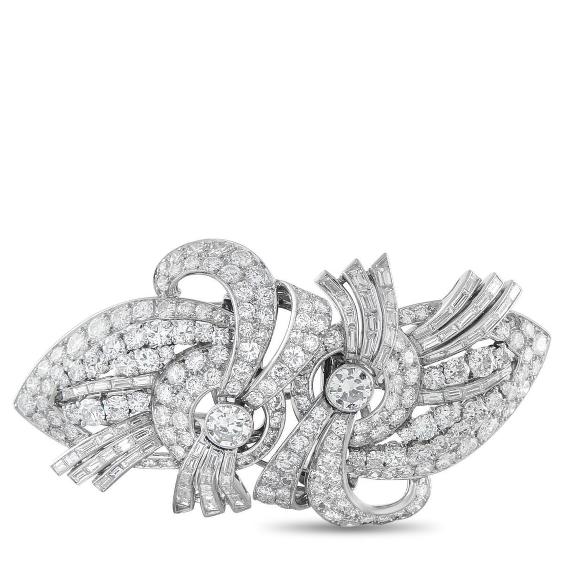 PLATINUM 14.0CT DIAMOND BROOCH: This brooch is simply stunning to behold. The curved, ribbon-like design comes to life thanks to a dazzling array of Diamonds totaling 14.0 carats. Set in Platinum, this impressive accessory measures