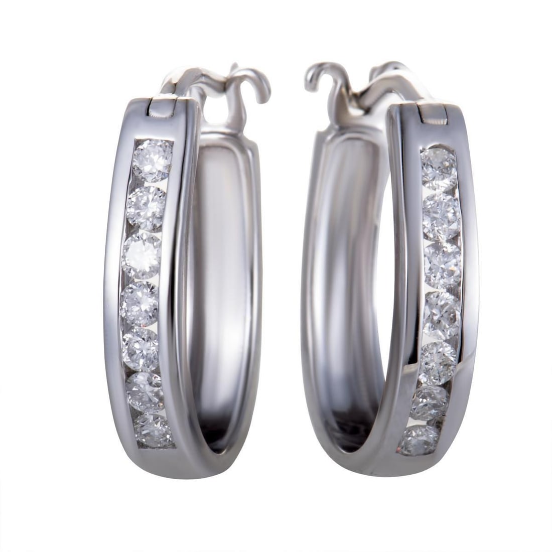 14K WHITE GOLD OVAL CHANNEL SET DIAMOND HOOP HUGGIES EARRINGS .33 CARAT (0.33 CTW) DIAMONDS: The elegantly gleaming 14K white gold and the luxuriously glistening diamond stones complement each other wonderfully in these gorgeous hoop earrings that offer a delightfully classy appearance. The