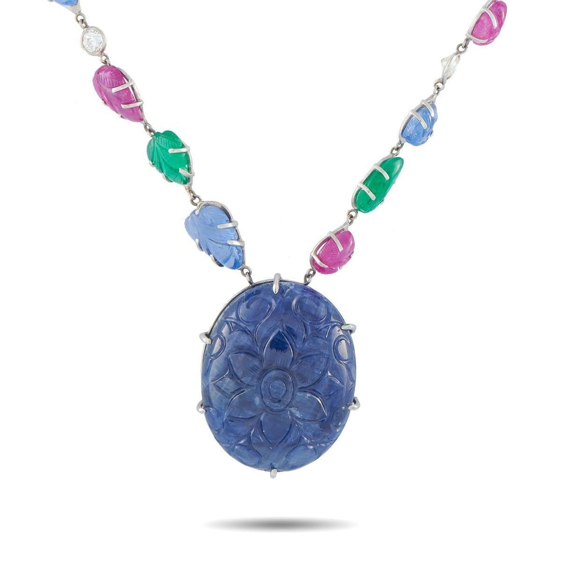 PLATINUM 4.25CT DIAMOND, SAPPHIRE, EMERALD, AND RUBY TUTTI FRUTTI NECKLACE: An array of vibrant colors makes this Tutti Frutti necklace impossible to ignore. Carved Burma No Heat Rubies, Sapphires, and Emeralds with a combined weight of 50.0 carats provide this piece with exq
