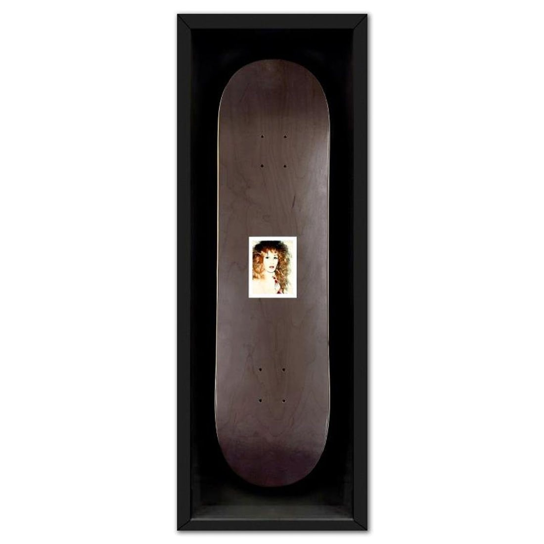 Andy Warhol (1928-1987), "Self Portrait (Black)" Framed Unique Edition Skateboard, Plate Signed with: "Self Portrait (Black)" is a skateboard by Andy Warhol (1928-1987), bearing the plate signature of the artist. This piece comes custom framed. This piece is from a unique edition in partnership with