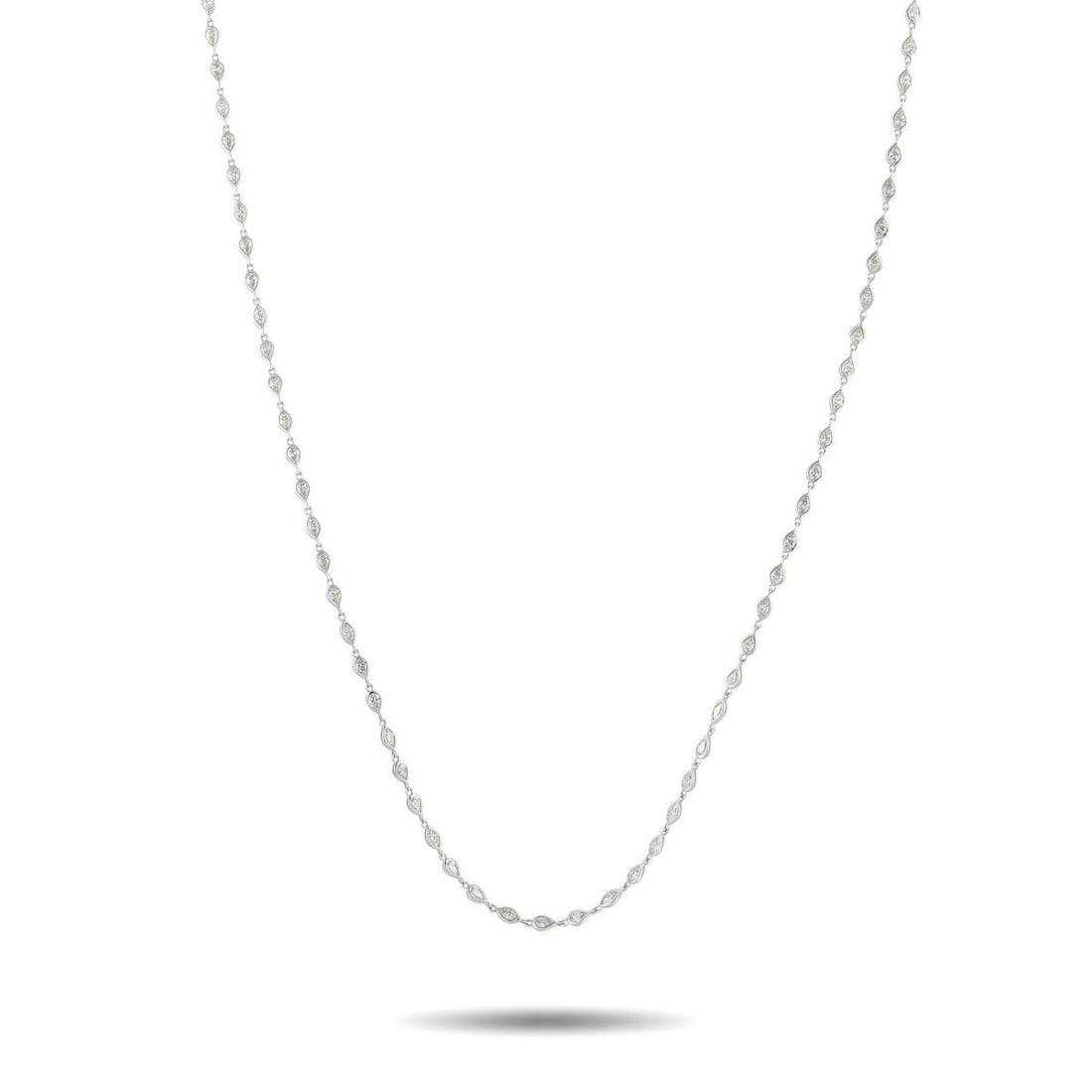 18K WHITE GOLD 7.10CT DIAMOND NECKLACE: This 18K White Gold necklace is ideal for any occasion. A series of round-cut Diamonds totaling 7.10 carats shine to life from their place within a sleek bezel setting. A dramatic 28 length makes this
