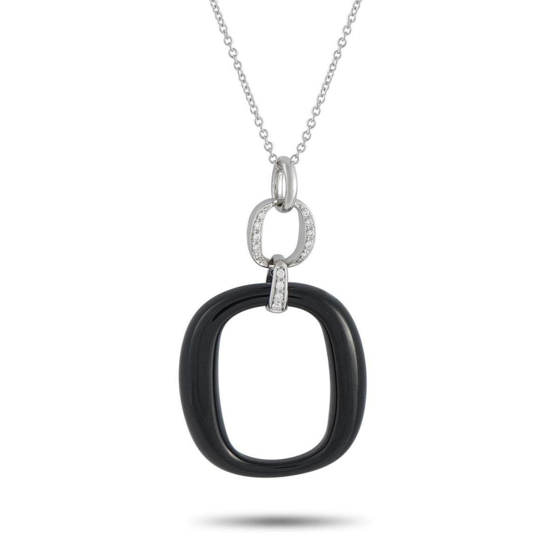 DAMIANI 18K WHITE GOLD DIAMOND AND ONYX NECKLACE: A minimalist design gives this Damiani necklace a contemporary point of view. Suspended from a 19.5 chain, the dramatic pendant pairs black Onyx with sparkling inset Diamonds. The pendant is crafted f
