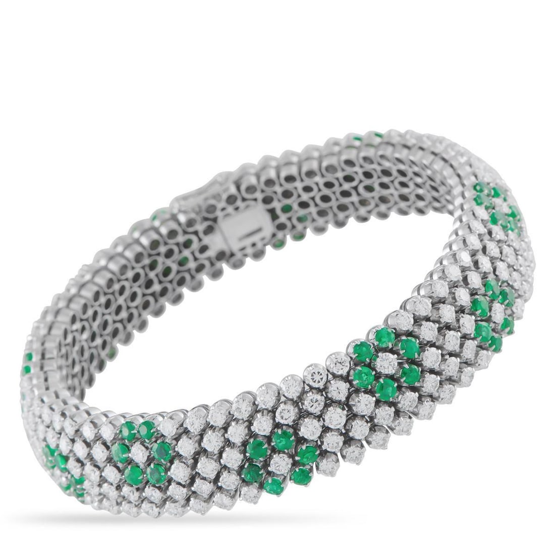 18K WHITE GOLD 11.0CT DIAMOND AND EMERALD BRACELET: Covered in sparkling gemstones, this luxurious bracelet is impossible to ignore. Diamonds with a total weight of 11.0 carats make it instantly eye-catching, while vibrant Emerald accents totaling 6.50