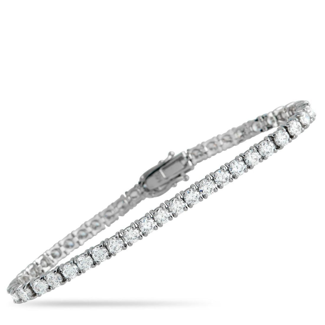 14K WHITE GOLD 8.80CT LAB-GROWN DIAMOND TENNIS BRACELET: This simple, elegant tennis bracelet will never go out of style. Set in 14K White Gold, Lab Grown Diamonds with a total weight of 8.80 carats allow it to come alive every time it catches the light. It