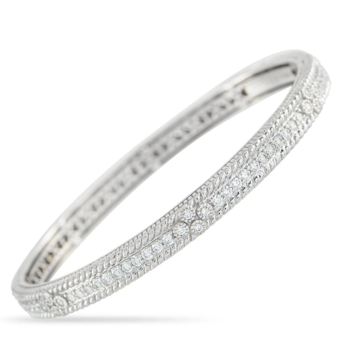 JUDITH RIPKA 18K WHITE GOLD 1.25CT DIAMOND BRACELET: This luxurious Judith Ripka bracelet will make any ensemble more impressive. The textured 18K White Gold setting is elevated by inset Diamonds totaling 1.25 carats, which add elegance to every