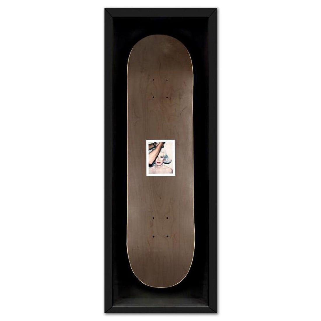 Andy Warhol (1928-1987), "Self Portrait (Black)" Framed Unique Edition Skateboard, Plate Signed with: Self Portrait (Black) is a skateboard by Andy Warhol (1928-1987), bearing the plate signature of the artist. This piece comes custom framed. This piece is from a unique edition in partnership with