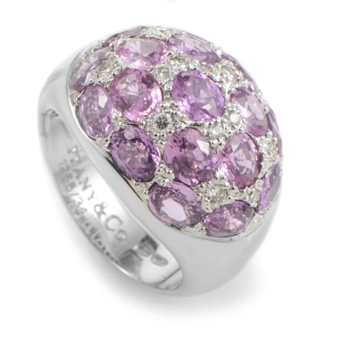 TIFFANY & CO. 18K WHITE GOLD PINK TOURMALINE & DIAMOND DOME RING: Luxurious and feminine, this ring from Tiffany & Co. is sure to be treasured for many years to come. The ring is made of 18K white gold and features a glittering white diamond and pink tourmaline pave