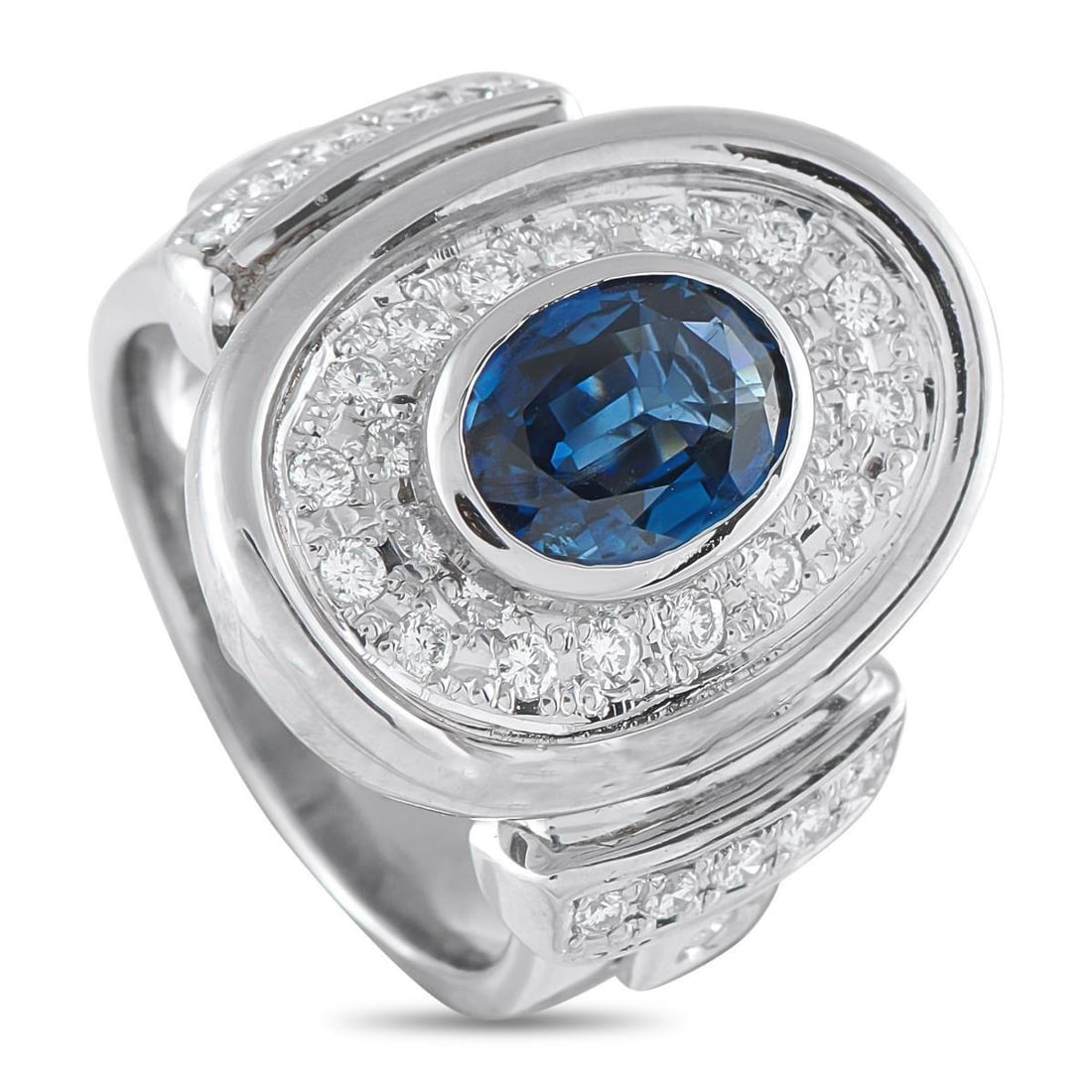 PLATINUM 0.61CT DIAMOND AND SAPPHIRE RING: A uniquely elegant design makes this ring simply unforgettable. The circular Platinum setting is highlighted by inset Diamonds totaling 0.61 carats. At the center, a 2.06 carat Sapphire serves as a st