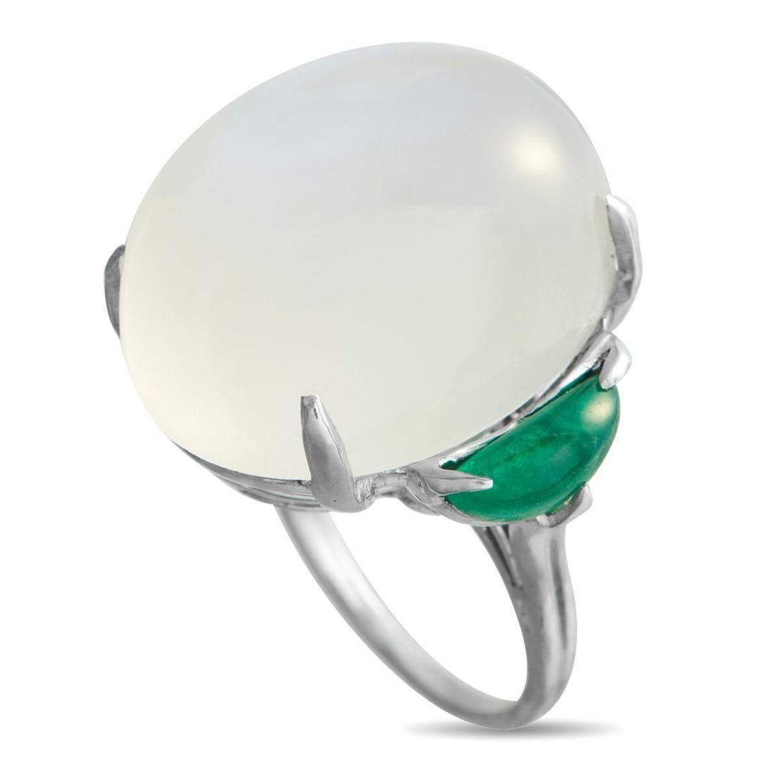 PLATINUM 2.20CT EMERALD AND MOONSTONE STATEMENT RING: Long tied to lunar symbolism, moonstones have a quiet pull that holds the eye. This platinum ring centers on a substantial 32.0 carat moonstone cabochon, its domed surface alive with shifting light. R