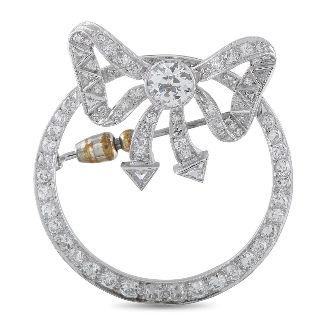 PLATINUM AND 14K WHITE GOLD 4.10CT DIAMOND WREATH BROOCH: Crafted in platinum and 14k white gold, this brooch takes the form of a wreath. The circular outline is traced with round diamonds that gradually reduce in size as they ascend, creating a gentletaper