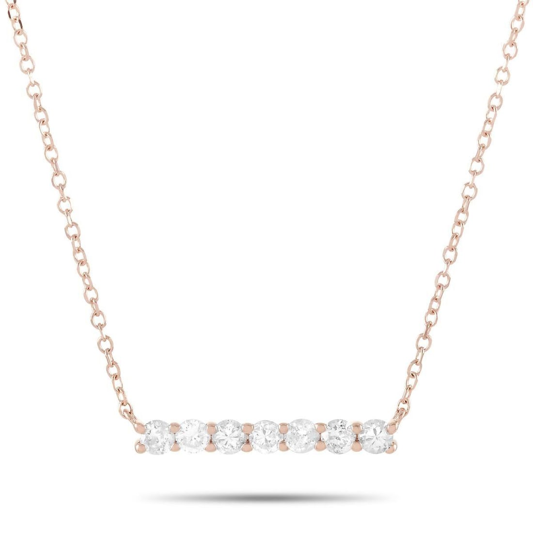 14K ROSE GOLD 0.25 CT DIAMOND PENDANT NECKLACE: This necklace is crafted from 14K rose gold and weighs 1.4 grams. It is presented with a 15 chain and boasts a pendant that measures 0.13 in length and 0.50 in width. The necklace is set with