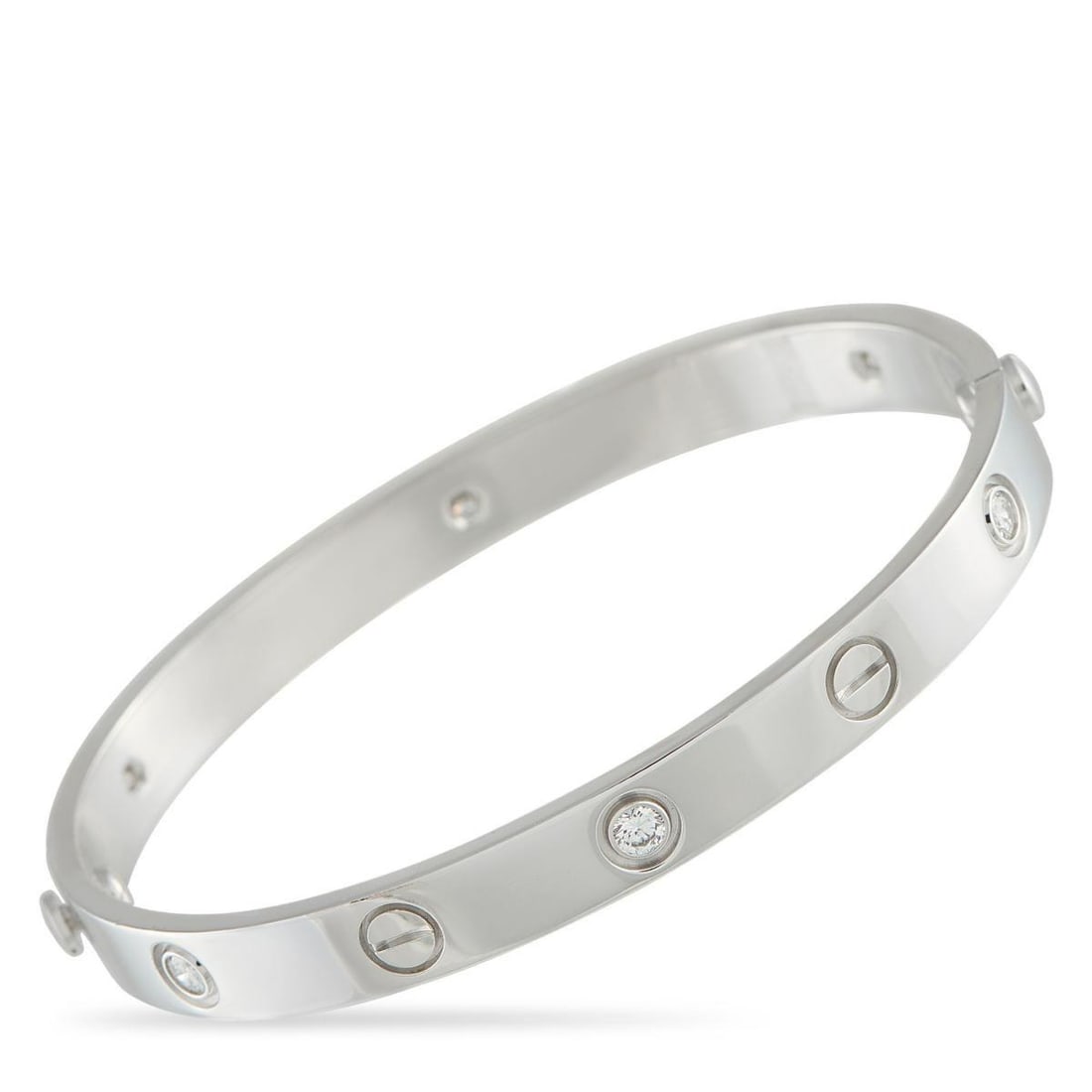 CARTIER LOVE 18K WHITE GOLD 6-DIAMOND BRACELET: This Cartier LOVE bracelet is one of the luxury brand's most iconic pieces. Sleek and stylish, this 18K White Gold bangle features a series of 6 round-cut diamonds and circular motifs. It measures 6.7