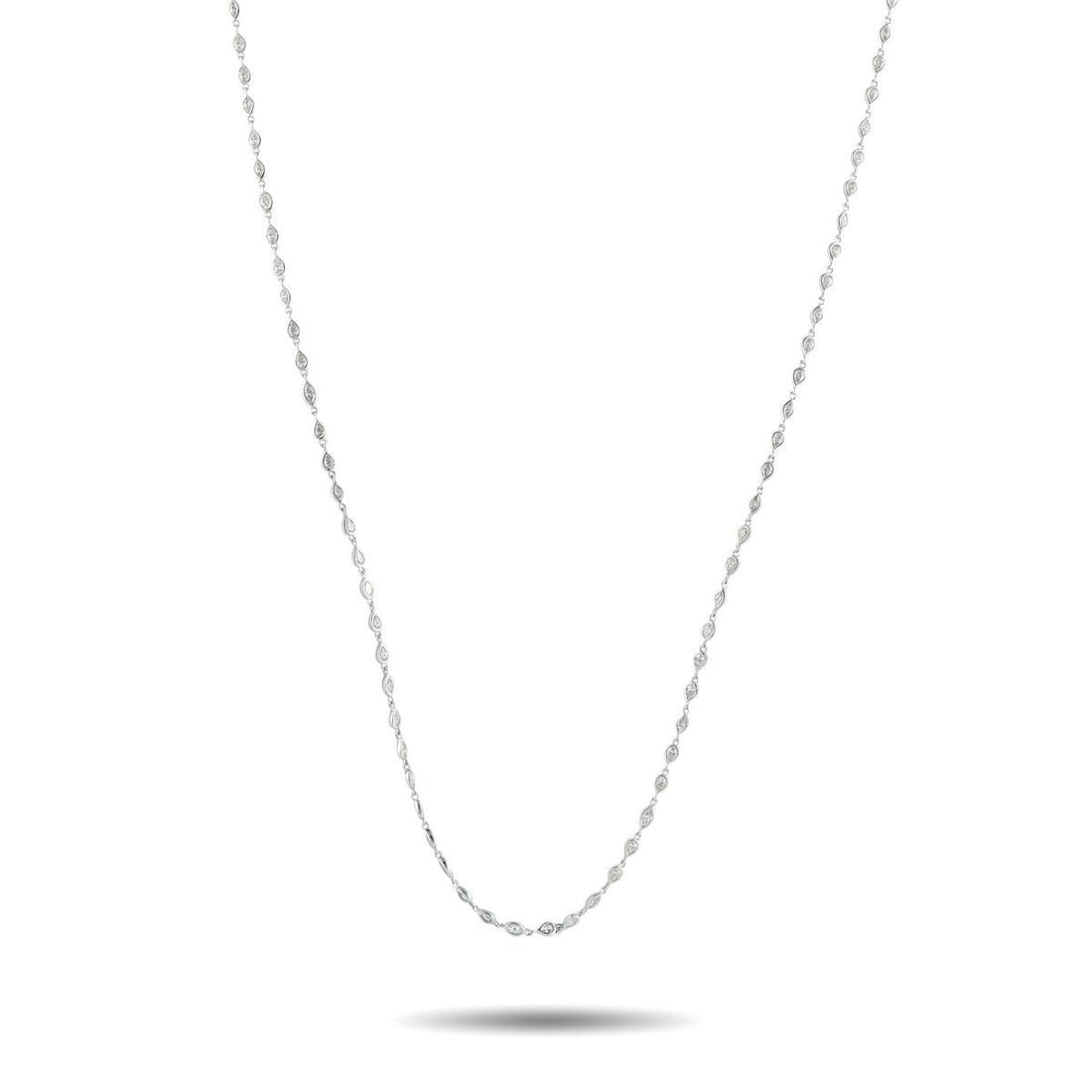 18K WHITE GOLD 7.85CT DIAMOND LONG NECKLACE: A versatile necklace that layers beautifully yet stands out on its own. This piece features a continuous line of delicate pear-shaped and marquise-shaped bezels, each set with a fine diamond. The peti