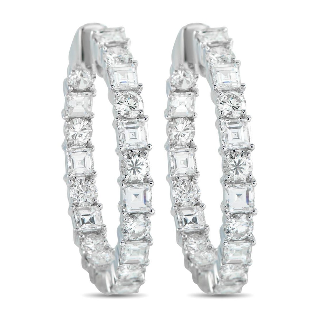 18K WHITE GOLD 6.75CT DIAMOND INSIDE-OUT HOOP EARRINGS: Clean and direct, these white gold hoops are set with alternating round brilliant and carr-cut diamonds along the outer front edge and inner front curve. The pattern keeps the stones in view from ever
