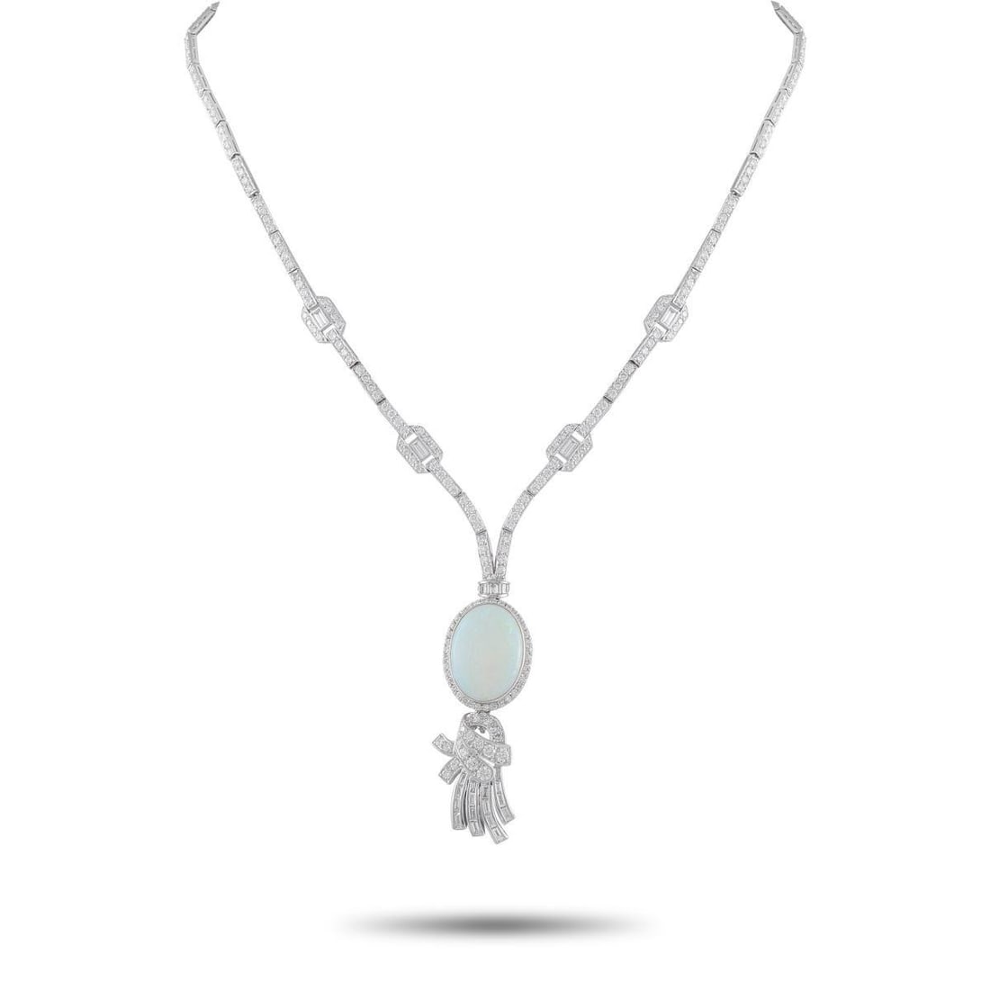 PLATINUM 5.60CT DIAMOND AND OPAL NECKLACE: This luxury necklace is an opulent piece that perfectly captures the elegance of the Art Deco era. A tassel motif and a captivating 9.70 carat Opal center stone add charm and sophistication to the ove
