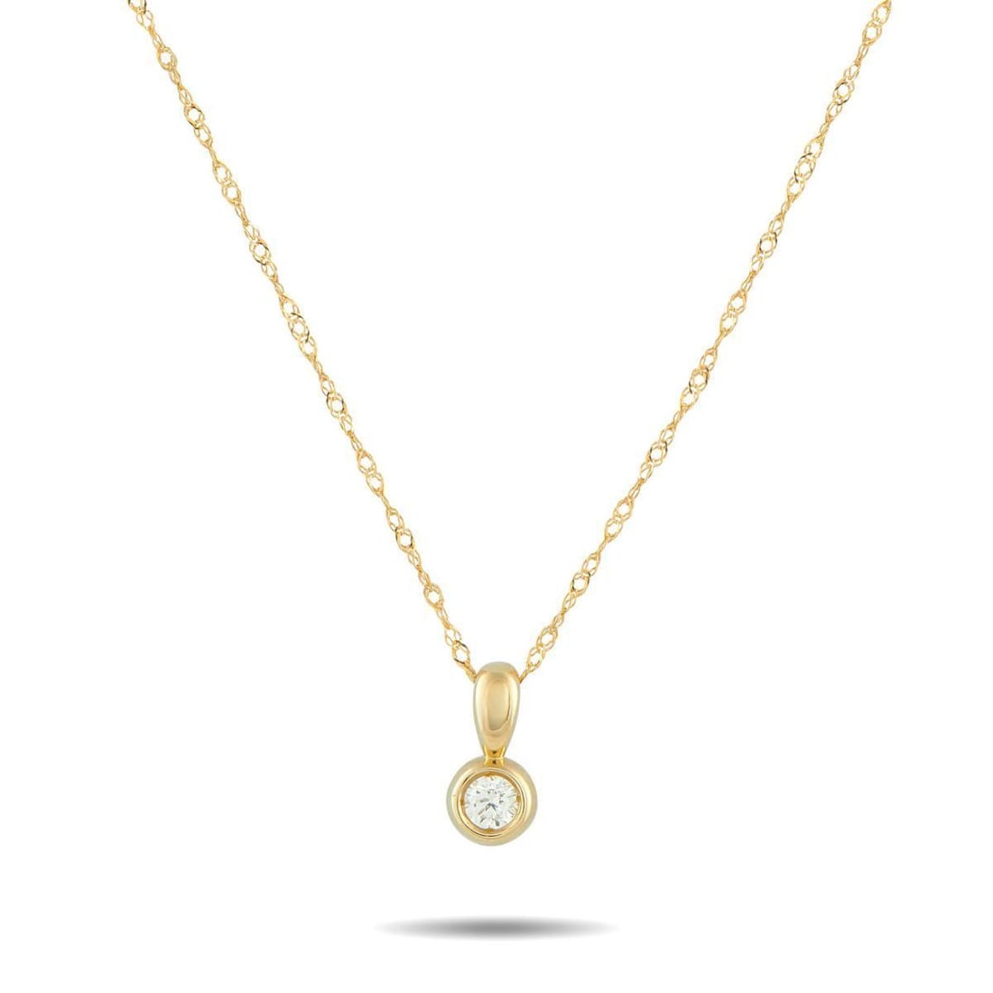 14K YELLOW GOLD 0.10CT DIAMOND SOLITAIRE PENDANT NECKLACE: Simple, bright, and easy to wear every day. This piece has a yellow gold chain that holds a 0.10 ct round diamond in a seamless bezel-and-bail design. The diamond sits close to the neckline, catching